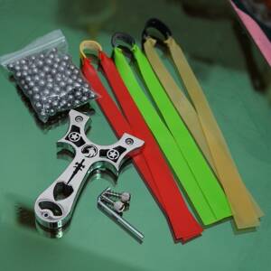 1 Knife Slingshot + 3 Bands + 144 Steel Balls + 1 L key + 2 Extra Nuts