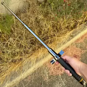 Expandable steel telescopic self-defense baton with a crossguard and textured grip handle.